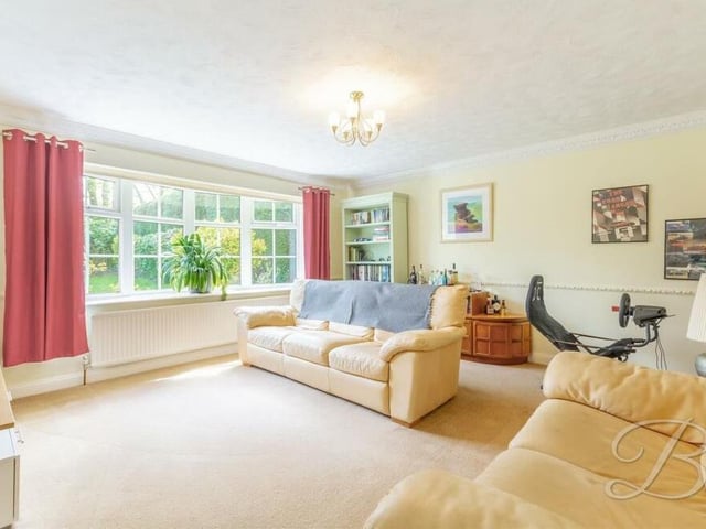 Next stop at the High Oakham Road property is this sumptuous sitting room, which has a fitted carpet and a large window overlooking the front of the house.