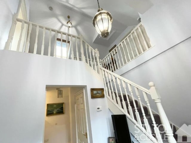 It's time to take a look at the upper floor now, so let's return to the hallway and climb the staircase.