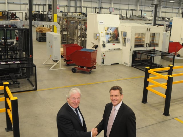 Mansfield Executive Mayor Tony Egginton, left,  pictured with Crown Speciality Packaging UK's Operations Director David Harrison at the opening of the company's new factory on Crown Farm Way.