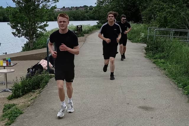 Rueben approaches the finish line, followed by Josh and Alex