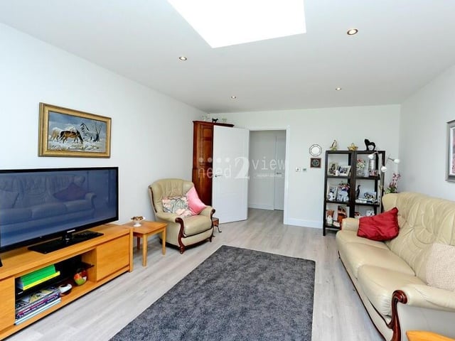 A look at the sizeable lounge from a different angle. Underfloor heating, which has been installed throughout the property, adds to the warmth and comfort of the room.