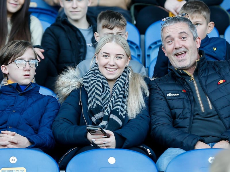 Mansfield Town fans watch their team win at home against Scunthorpe Utd.