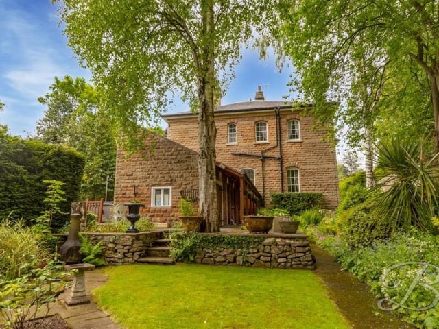 This is the enticing view from the back of the £925,000-plus property, with steps leading down to the garden.