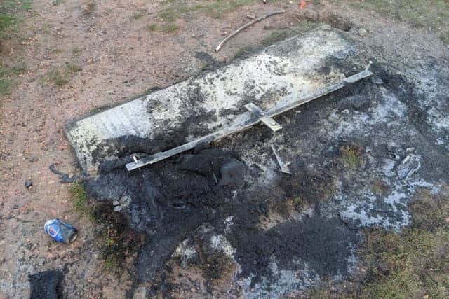 A burned-out bench at Vicar Water Country Park.