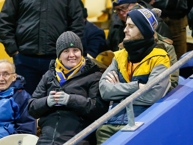 Mansfield Town's faces in the crowd against Swindon Town.