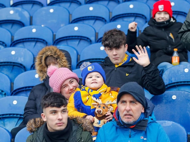 Mansfield Town fans at the One Call Stadium for the Emirates FA Cup third round match against Middlesbrough.