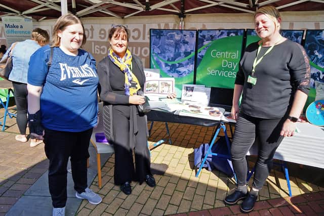 Melanie Lee and Toni Crew from Ashfield Day Services talk to Sussie Johnson.