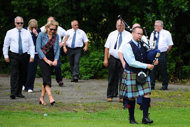 Piper James Strathie, of The Royal Burgh of Stirling Pipe Band leads the procession.