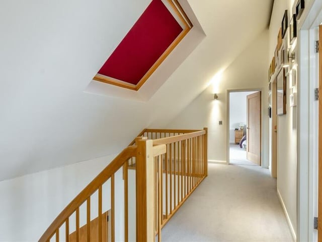 Let's return to the staircase now and move up to the galleried landing on the first floor, which will guide us to the remaining two bedrooms at the Sutton eco-home.