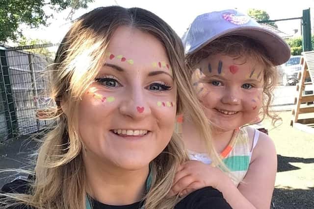 Tia Garrity, Cherubs Edwinstowe day nursery co-ordinator, enjoying festival fun with Rianne Moore, aged four.