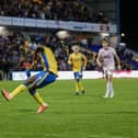 Mansfield Town progressed after beating Peterborough United on penalties.