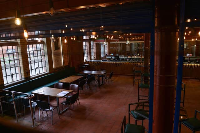 Beer is brewed in the back of the bar.