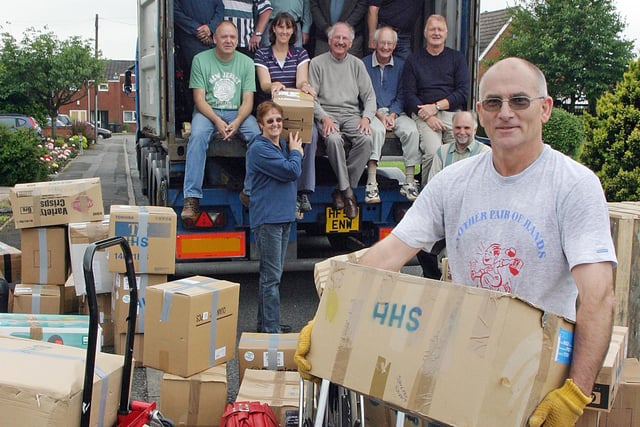 2007: Volunteers on Woodlands Way, Eastwood, load a 40-foot container with goods for Halcyon Link Trust in Uganda.