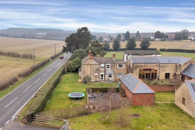 A terrific aerial view of The Old Farmhouse in relation to Blidworth Lane. It shows how a holly hedge boundary screens the plot from the main road.