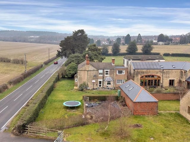 A terrific aerial view of The Old Farmhouse in relation to Blidworth Lane. It shows how a holly hedge boundary screens the plot from the main road.