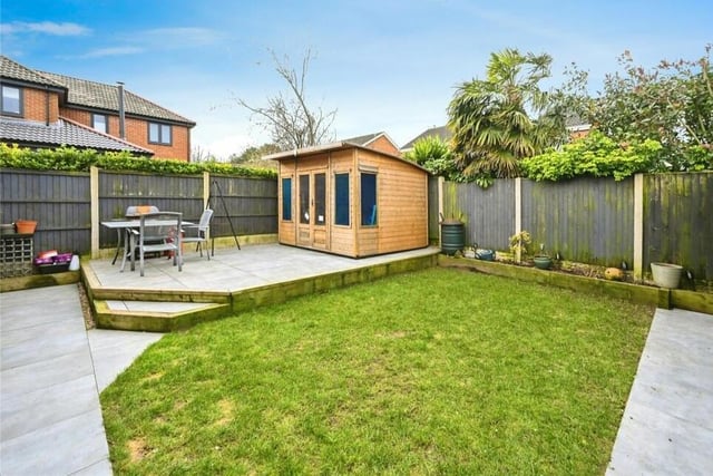 The rear garden is landscaped and low maintenance, complete with small lawn, non-slip porcelain tiled floor and raised seating area. Outbuildings include a storage shed.