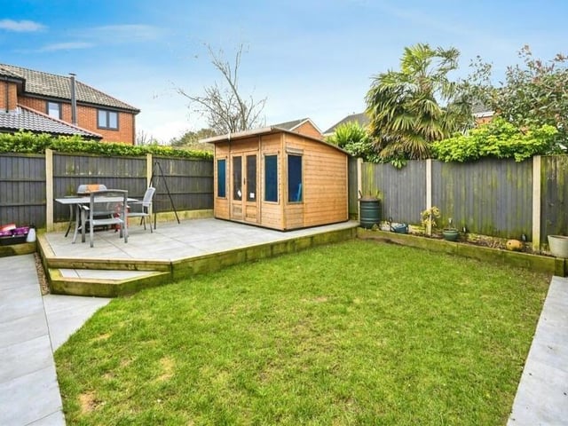 The rear garden is landscaped and low maintenance, complete with small lawn, non-slip porcelain tiled floor and raised seating area. Outbuildings include a storage shed.