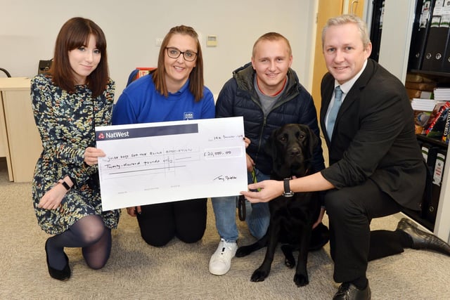 £20,000 cheque presented to Guide Dogs for the Blind at the Chad office. 
Reporter Danielle Andrews, Nichola Bonsall community fundraising development officer for Guide Dogs for the Blind, Nathan Edge and  Chad editor Jon Ball.