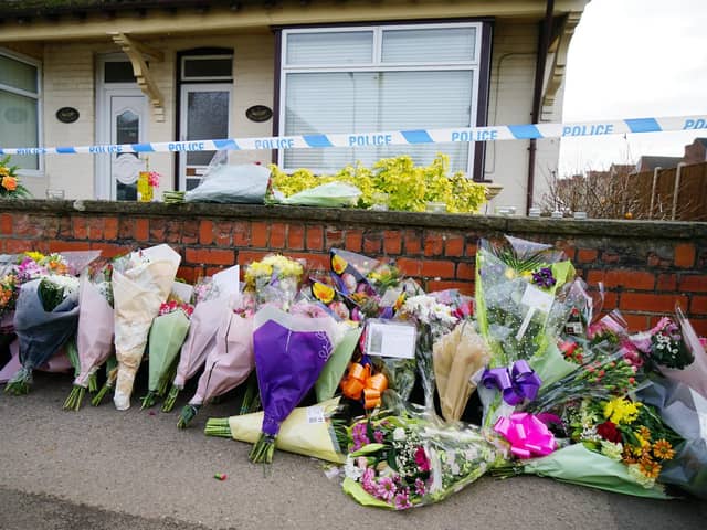 Floral tributes have been left outside the Langwith Junction house of Freda and Ken Walker. Pictures by Brian Eyre.