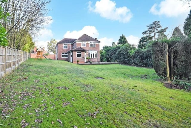 You've seen the front, now check out the back of the property, with its large lawned garden. It offers privacy and seclusion with mature hedgerow borders and secure perimeters. The house sits on a plot spanning half an acre.