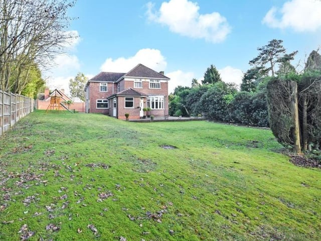 You've seen the front, now check out the back of the property, with its large lawned garden. It offers privacy and seclusion with mature hedgerow borders and secure perimeters. The house sits on a plot spanning half an acre.