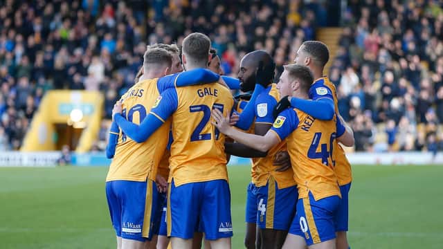 Mansfield Town lost ground on Salford after being held by Rochdale on Easter Monday,
