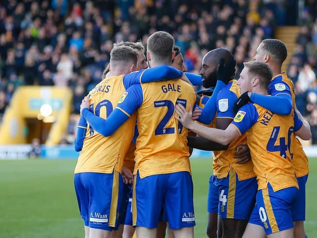 Mansfield Town lost ground on Salford after being held by Rochdale on Easter Monday,