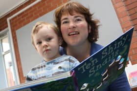 2010: Pictured at the Kimberley Library story session are Jake Woodward, two, and library service adviser Wendy Walker.