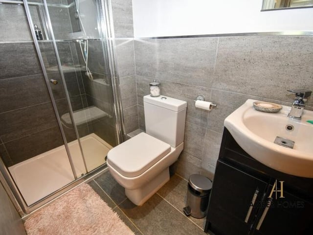 For added luxury and convenience, step in to the en suite shower room that is part of the master bedroom. As well as a walk-in shower cubicle, there is a wash hand basin with storage and a low-level WC.