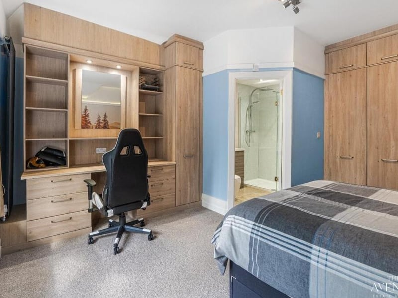A close-up of the desk and storage space in this bedroom at Lanesend House.