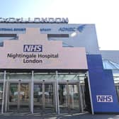 Newly installed signage for the field hospital to be known as the NHS Nightingale Hospital being created at the ExCeL London exhibition centre in London. (Photo by Glyn KIRK / AFP)
