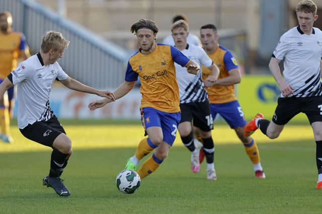 Mansfield Town forward Will Swan runs at the Rams' defence.
Photo Credit Chris HOLLOWAY / The Bigger Picture.media