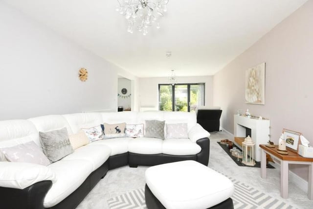 The kitchen leads into this lovely lounge. Bright, spacious and comfortable, the room is part of an open-plan area on the ground floor. Another pair of double doors gives access to the back garden.