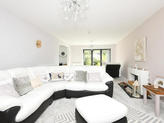 The kitchen leads into this lovely lounge. Bright, spacious and comfortable, the room is part of an open-plan area on the ground floor. Another pair of double doors gives access to the back garden.