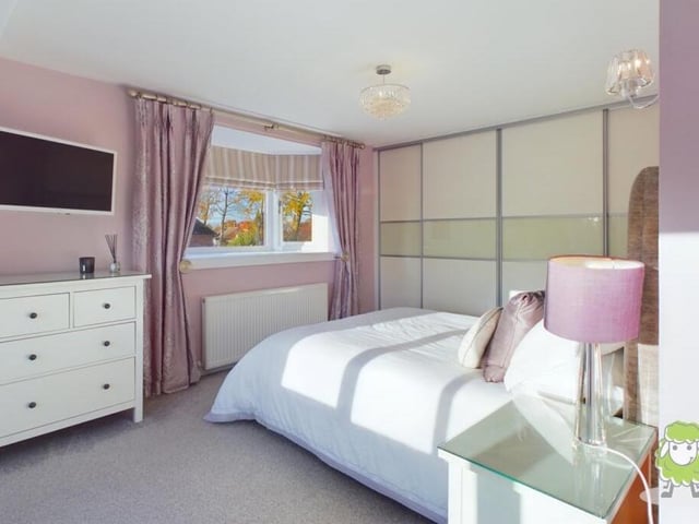 The first bedroom has plenty of space for wardrobes and drawers.