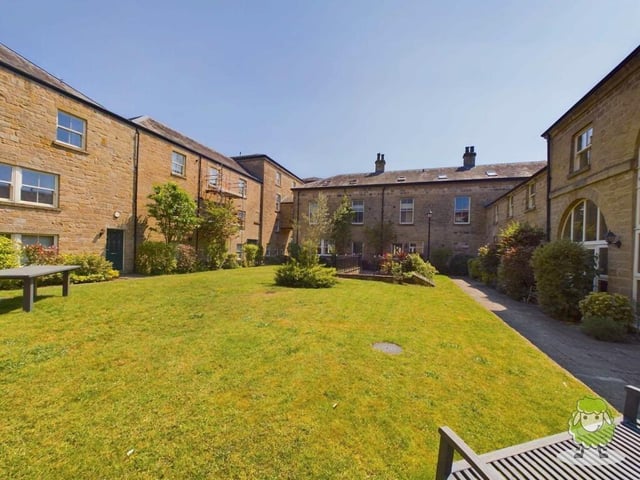 Let's step outside now, and take a look at the delightful, lawned courtyard, which is a private and picturesque setting for lazy summer days in the sun.