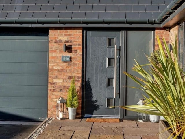 Let's step outside now to have a look at the external features of the impressive £470,000 Skegby residence. The front door is typical of easy-on-the-eye finishings in graphite grey.