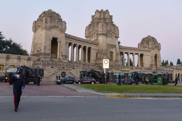 Army trucks parked outside a cemetery in Bergamo, Italy, which is one of the areas worst hit by coronavirus (Photo by STRINGER/ANSA/AFP via Getty Images)