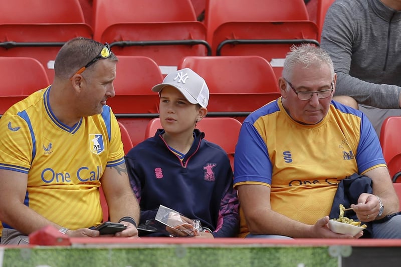 Mansfield Town fans watch a convincing 4-0 win at Alfreton Town.