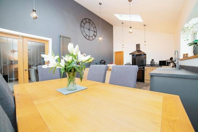 Within the kitchen, there is plenty of space for a delightful dining area. The doors you can see lead to the lounge.