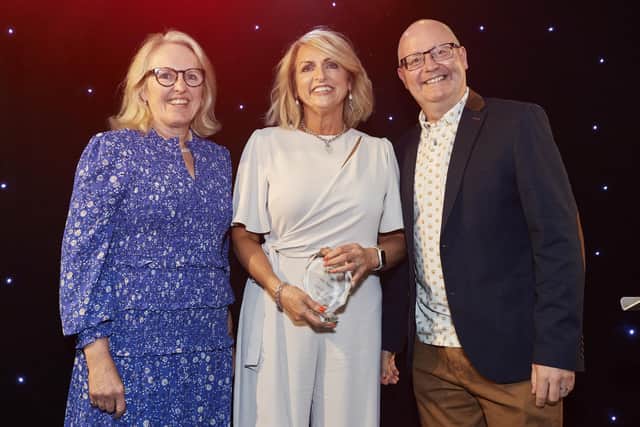 Nikki Slack, of West Nottinghamshire College, centre, with trust directors Sally Brook Shanahan and David Ainsworth. Nikki won the community hero award at Sherwood Forest Hospitals NHS Trust's 2023 excellence awards. Picture: Sherwood Forest Hospitals NHS Trust