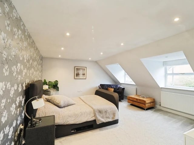 The master suite features a dressing area and en suite.