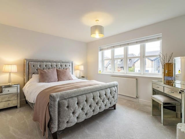 The second bedroom is another spacious sanctuary, beautifully presented.