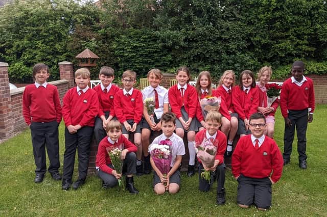 Children from the The Priory Catholic Voluntary Academy took flowers to a local care home.