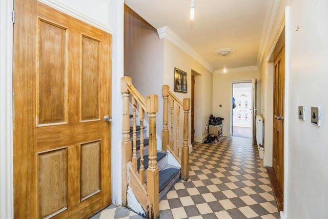 Before we go upstairs, let's pop into the entrance hall, which is distinguished by its tiled floor. It gives access not only to the staircase but also to the property's integral double garage.