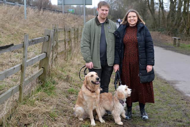 Rat boxes - kingsmill reservoir. Rebecca Burrows with dog Millie and partner Frank Roome and dog Teddy on the path near where the rat box was open.