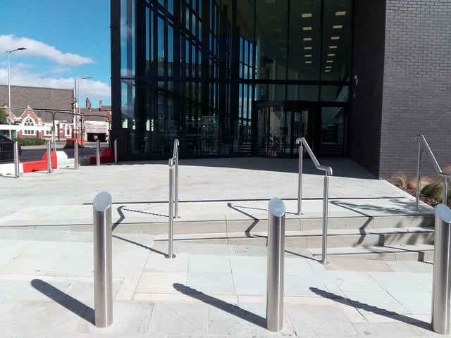The entrance to the library from Chamber Road looks complete and library shelves are visible inside, as well as the branding that can be seen on the glass at this entrance to the Danum Gallery, LIbrary and Museum