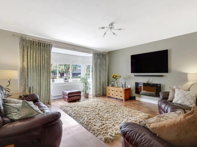 The living room is a bright and welcoming space, featuring a UPVC double-glazed bay window to the front elevation, allowing plenty of natural light into the room. Additional features include a radiator, TV point and attractive wood flooring, creating a practical and comfortable setting for everyday living and entertaining.
