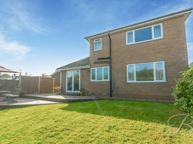 A neat and sizeable lawn at the back of the bungalow is ideal for relaxation or play. The garden is enclosed thanks to a fence surround.