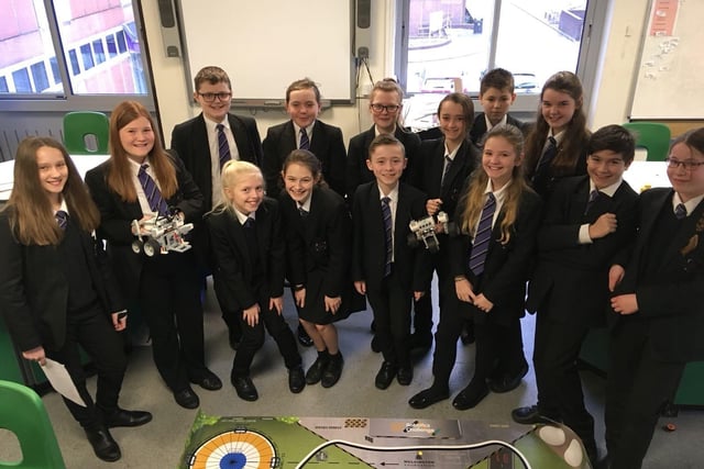Students from Sutton Community Academy with their robotics project in 2018.
